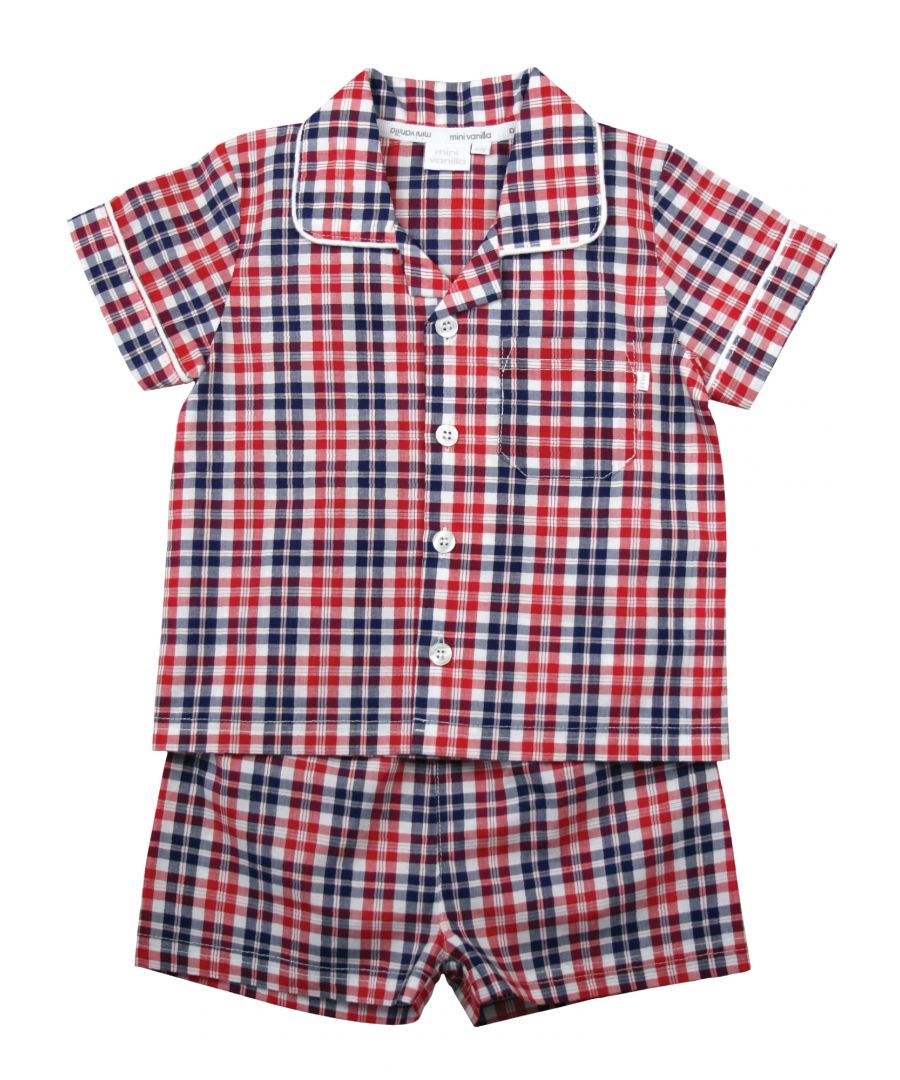 Red Check Cotton Traditional Summer Pyjamas.\n\nA timeless style given the Mini Vanilla treatment, our  Red, Blue & White check pyjama set for boys, is made from beautifully soft crisp summer weight woven 100% cotton and is trimmed with white cotton piping. The top has an open collar and revere, single chest pocket with a MV tab and it fastens at the front with Mini Vanilla engraved buttons.  The crisp cotton comfy shorts have a soft fully elasticated waist.\n\nSold as a Pyjama set.\nFabric 100% cotton - crisp summer weight.\nFire Warning : KEEP AWAY FROM FIRE AND FLAMES.\nWash Care Instructions : Machine wash inside out, do not soak, wash dark                   colours separately. Save energy and wash at 30 degrees.\nDo not tumble dry