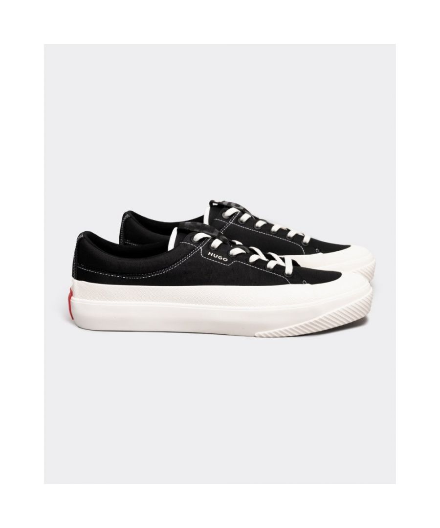 Modern trainers with a low profile and cotton lining by HUGO. Featuring a full vulcanized sole and a rubber bumper, these lace-up trainers are trimmed with a HUGO logo patch in signature red at the rear heel. The side panel and tongue carry further branding.\nLacesFully linedPackaging: Box\nUpper material: 100% Polyester, 100% Cotton, Sole: 100% Rubber, Innersole: 100% Cotton\n \n50474925