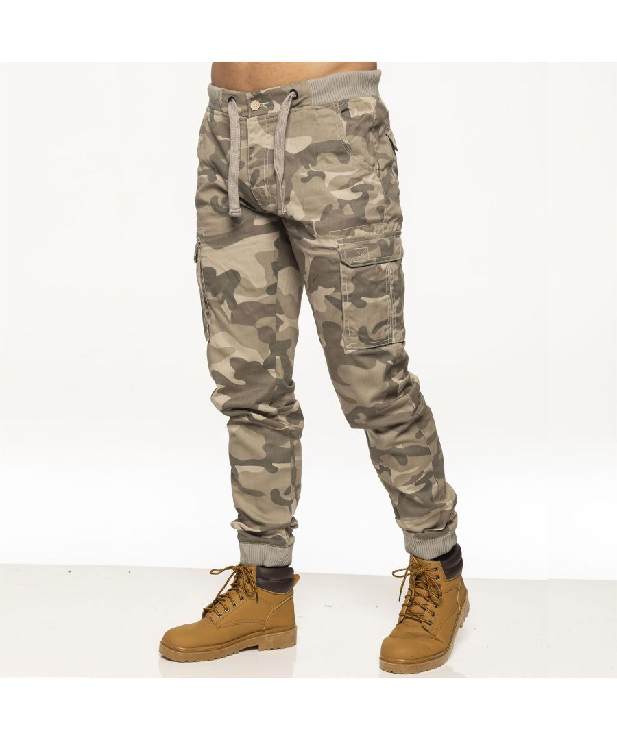 Enzo Men’s Camo Combat Cuffed Jogger Style Trousers in Beige, 65% Polyester, 35% Cotton, Elasticated Waist with Drawcord and Secured by Button, Mid Rise, Elasticated Ribbed Waist and Cuffs, 2 Front Pockets, 2 Buttoned Back Pockets and 2 Velcro Side Pockets, Zip Fly Fastening, Machine washable, Suitable For All Year Round Wear And Casual Occasions.