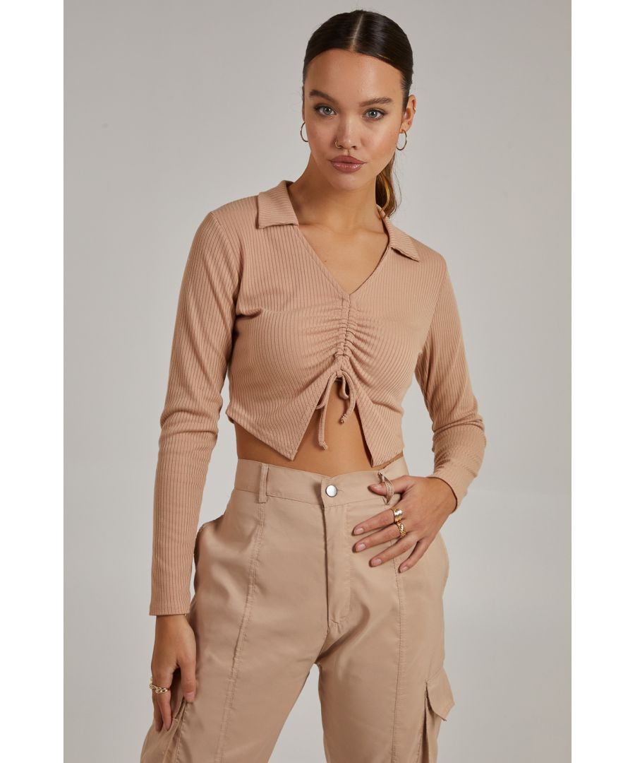 Shop our Long Sleeve Gathered Rib Top and feel great this season. Take this look from day to night, whatever the ocassion.