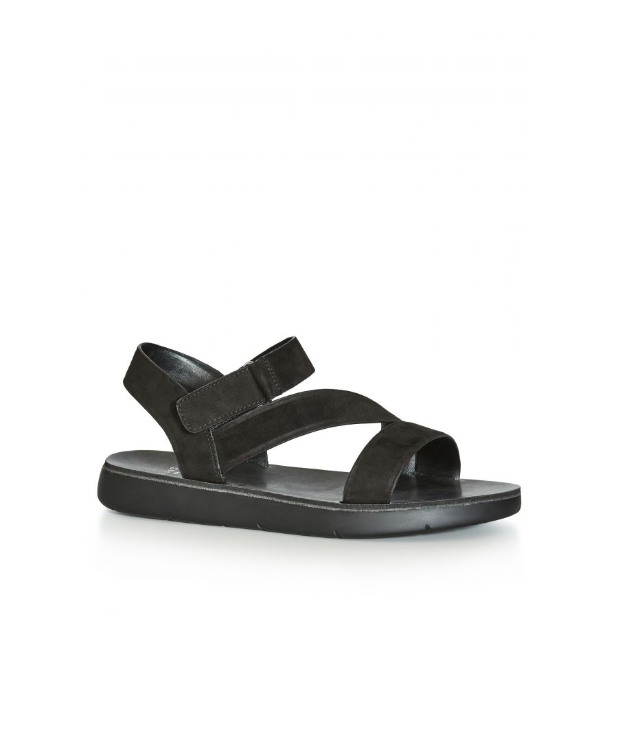 Being both seriously practical and totally trending, the Cross-Over Strap Sandal is a must-have pair for the new season! Find comfort in the chunky sole design of these everyday sandals, finished with thick straps and a faux-suede fabrication. Key Features Include: - Wide fit - Side velcro closure - Flat sole - Faux-suede fabrication Team with boyfriend jeans and a breezy cami for simple summer style.