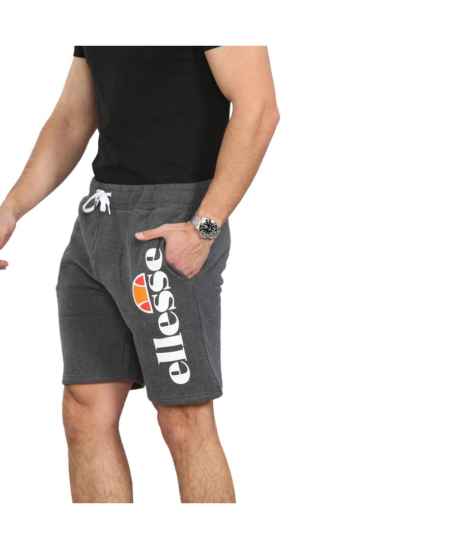 Great value, Ellesse Fleece Shorts in Black and Grey. 80% Cotton,20% Polyester. Featuring an Elasticated Waistband with Drawstrings for Comfort. Two front side slash pockets and 1 Back Pocket with Velcro Fastening, Ellese Printed Branding to Front For Casual, Gym and Travel Occasions.