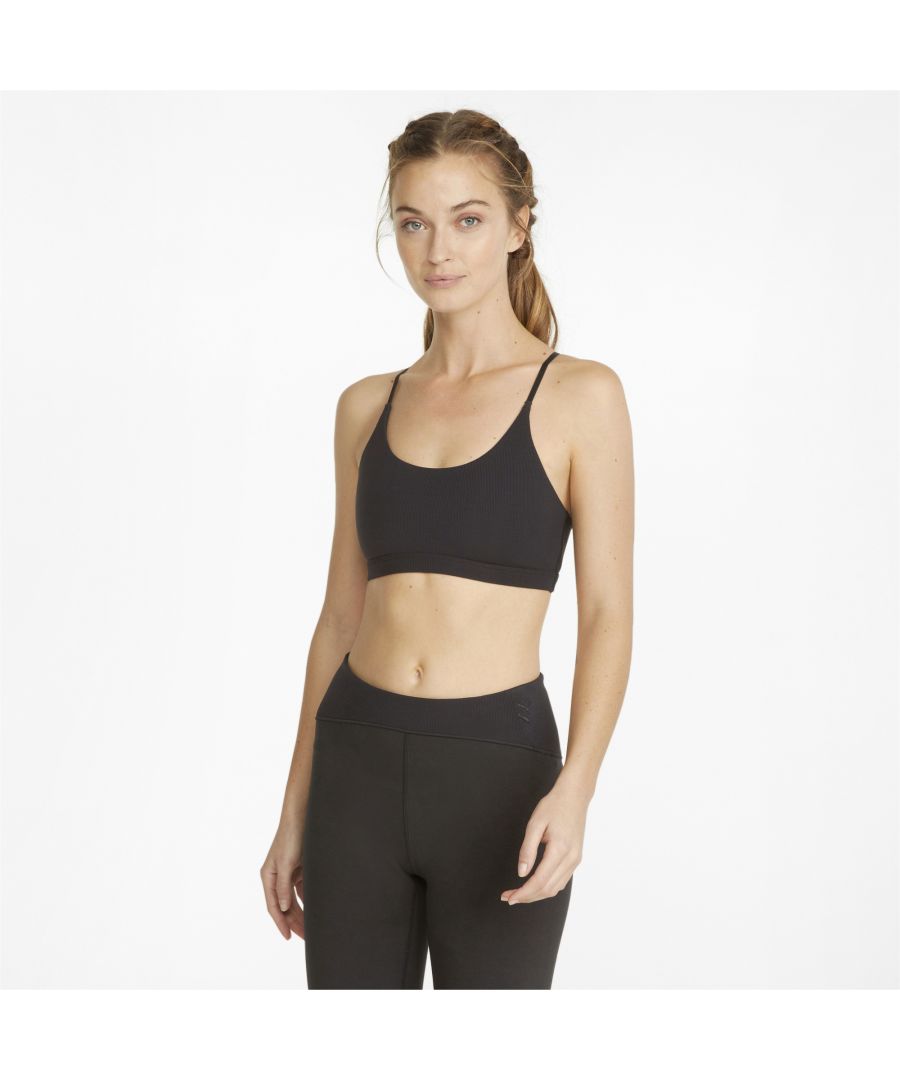 For light, stylish support during your workout, this simple bralette offers supreme comfort. The soft ribbed fabric and unpadded design give you a natural shape and maximum freedom of movement, and the delicate criss-cross straps are adjustable for the perfect fit. Ideal for low-impact exercise, this bra top can be worn under your favourite sports tee or on its own. FEATURES & BENEFITS Recycled Content: Made with at least 20% recycled material as a step toward a better future  DETAILS Non-padded braAdjustable strapsEmbroidered shiny mirrored PUMA Cat Logo at centre backModal, cotton, recycled cotton, recycled polyester and elastane
