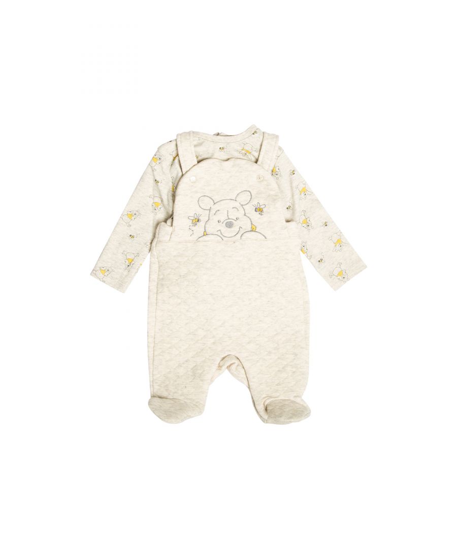 This adorable Disney Baby two-piece set features a Winnie the Pooh print. The set comes with an all-over printed, long sleeve top and a pair of quilted, footed dungarees. Both the top and dungarees are cotton, with popper fastenings, keeping your little one comfortable. This would make a lovely new addition to your little ones wardrobe!