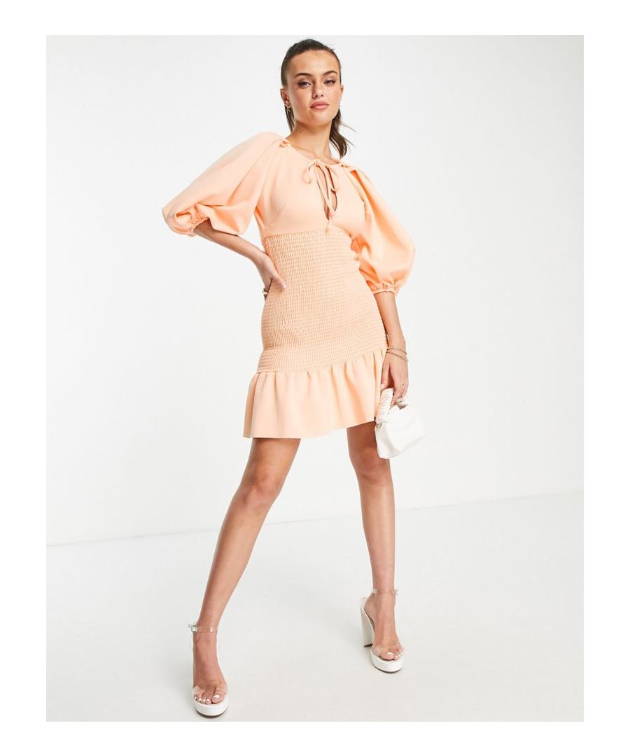 Mini dress by ASOS DESIGN Next stop: checkout Round neck Puff sleeves Key-hole front with tie detail Shirred, stretch panel Regular fit Sold by Asos