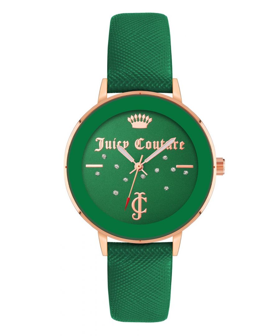 Juicy Couture Watch JC/1264RGGN\nGender: Women\nMain color: Rose Gold\nClockwork: Quartz: Battery\nDisplay format: Analog\nWater resistance: 0 ATM\nClosure: Pin Buckle\nFunctions: No Extra Function\nCase color: Rose Gold\nCase material: Metal\nCase width: 38\nCase length: 38\nFacing: Rhine Stone\nWristband color: Green\nWristband material: Leatherette\nStrap connecting width: 16\nWrist circumference (max.): 20\nShipment includes: Watch box\nStyle: Fashion\nCase height: 8\nGlass: Mineral Glass\nDisplay color: Green\nPower reserve: No automatic\nbezel: none\nWatches Extra: None