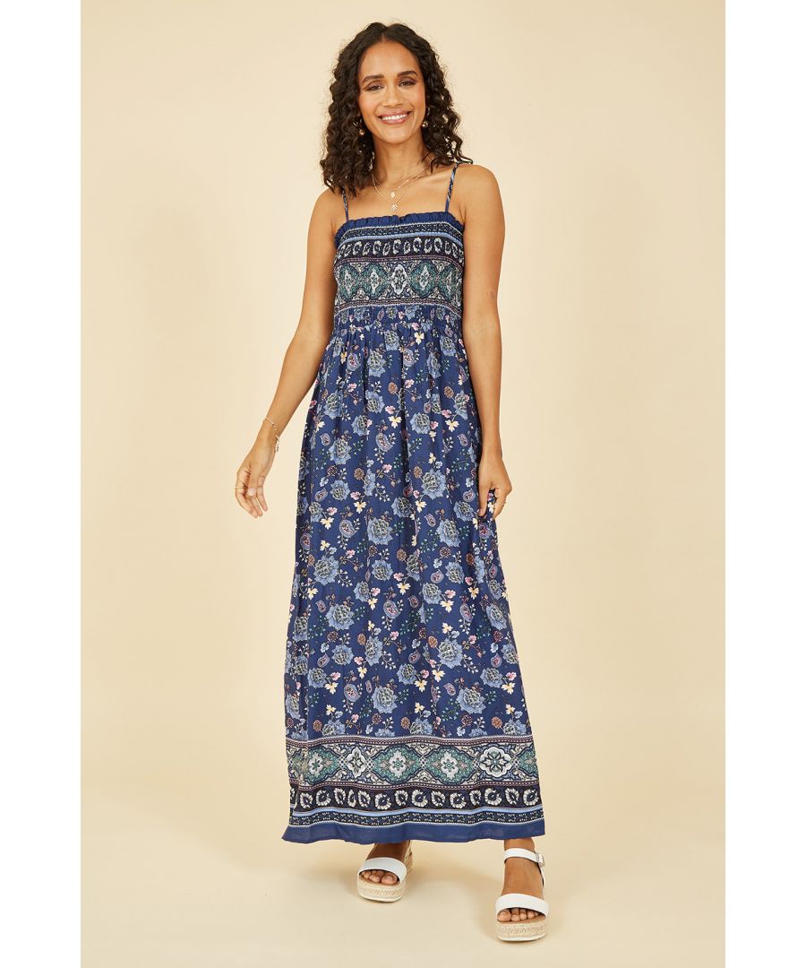 Try this Mela maxi dress for daytime summer plans, and make sure it has a spot in your suitcase for vacation vibes. The flowing maxi style is cool and comfortable with a shirred detailed bodice and neckline. Strappy sleeves and a border on the hemline finish this dress off perfectly, wear with a sun hat and sandals for everyday plans.