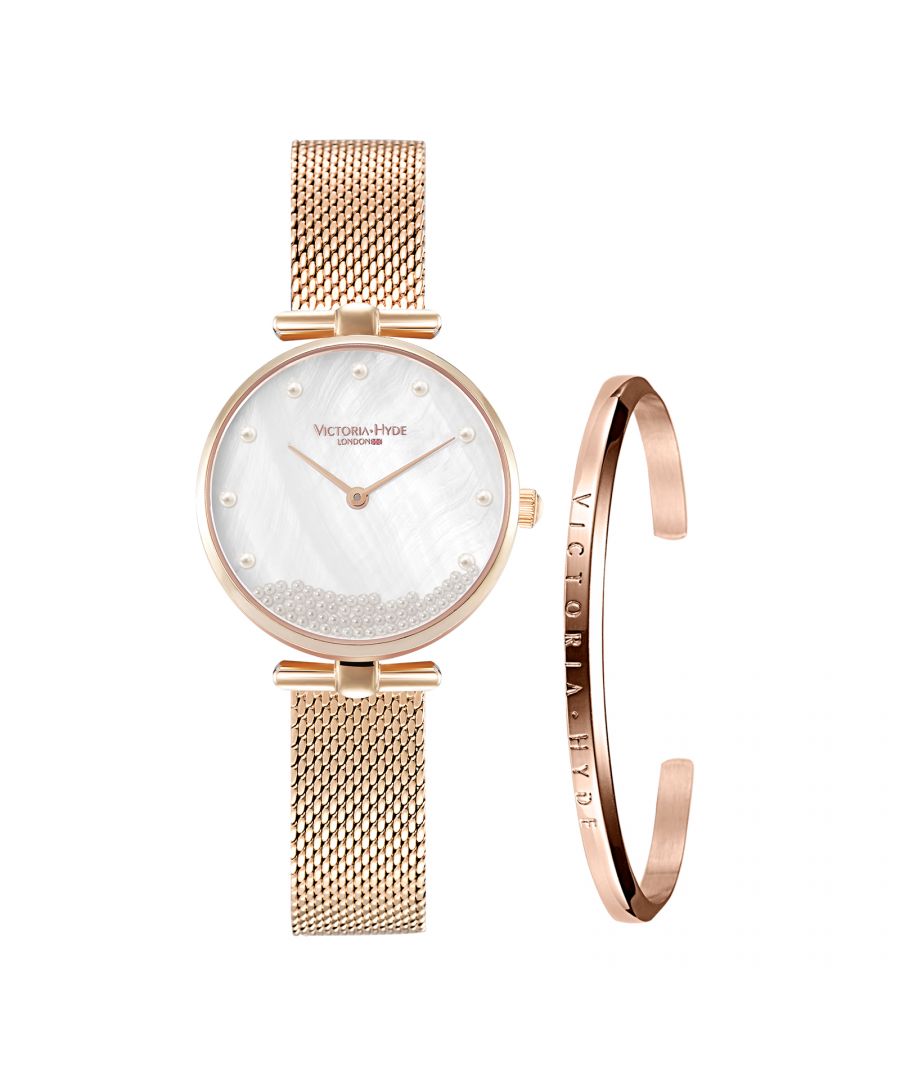 Elegance and modernity combined: the new Pearl wristwatch in rose gold from Victoria Hyde London. The watch impresses with its unique and sophisticated design, which has been enhanced with loving details. The stainless steel mesh bracelet in rose gold combined with the moving white pearls make the Pearl watch a very special eye-catcher. The dial shimmers in mother-of-pearl and exudes timeless style.\nMovement：Miyota 2035\nCase material: brass\nGlass: mineral glass\nCase diameter: 30mm\nCase thickness：8.8mm\nWatch strap width: 12 mm