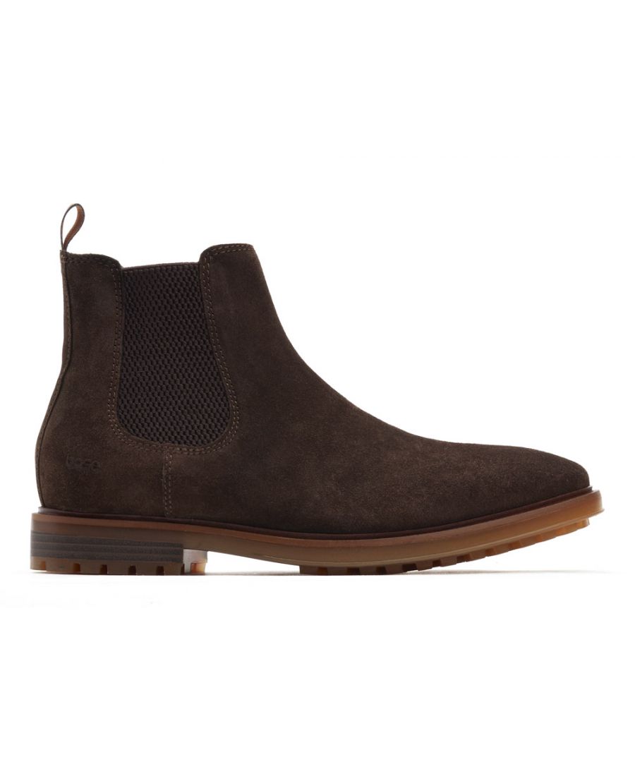 Chelsea boots are a staple for every manís foot locker  theyíre easy to slip on and incredibly versatile. The Garrison boot from Base London is no exception  with a strong nylon pull-tab and an elasticated gusset itís easy to get on and the plain leather uppers provide little distraction when pairing with smart or casual outfits. The slim rubber sole is understated and gives this boot a more formal appeal while the soft leather uppers and cushioned inner sole will provide comfort on long engagements.
