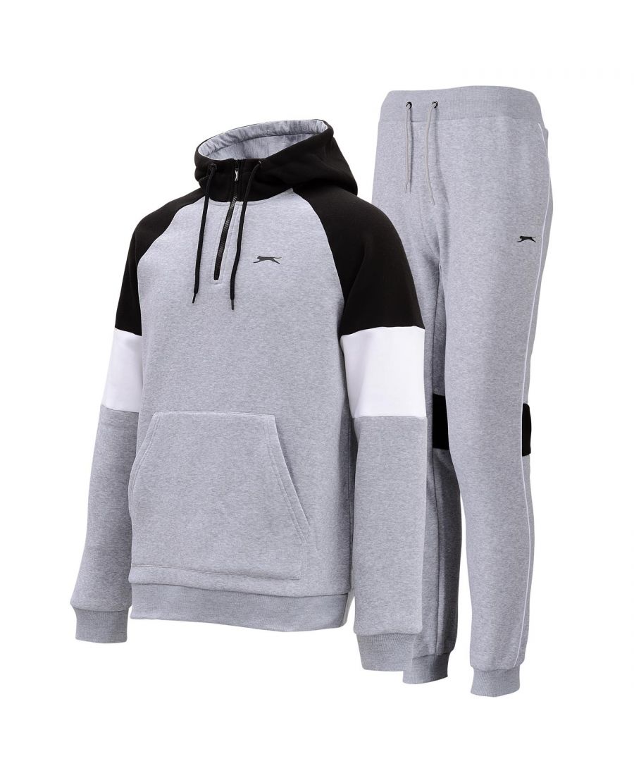 Slazenger Fleece Tracksuit Mens - The Mens Slazenger Fleece Tracksuit are a great addition to your loungewear collection, featuring an over the head hoody with an elasticated and ribbed trim to the wrist cuffs and hem, coupled with an elasticated waistband to the bottoms with an adjustable drawcord that provides a comfortable and secure fit. A colourblock design to the hoody along with a large pouch pocket and the classic Slazenger branding completes the look.