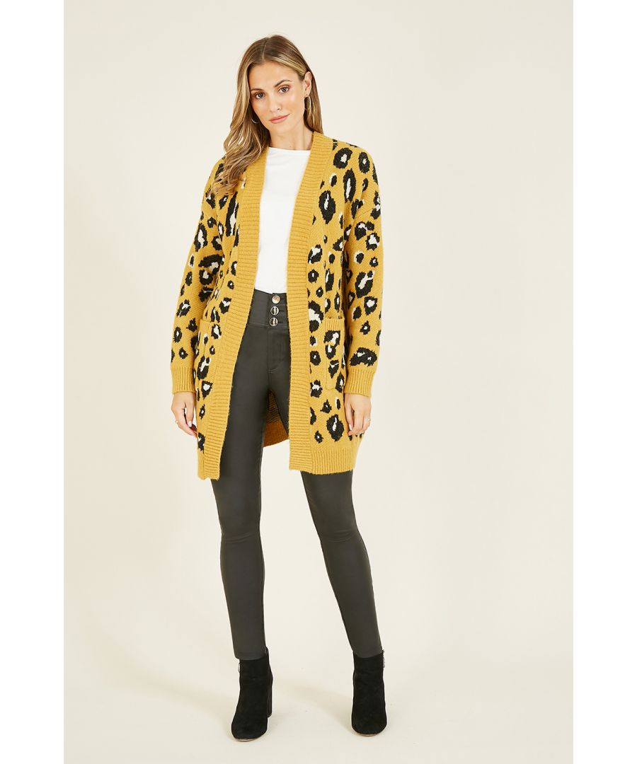 Stand out this season in this stunning Yumi Mustard Animal Intarsia Long Cardigan. Timeless animal print in on-trend mustard. This piece is knitted using the intarsia technique, features ribbed edging and roomy pockets. Perfect for layering - because warm shouldn't have to mean boring.