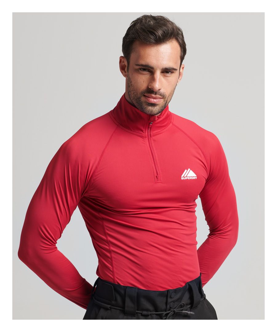 Add an extra layer of warmth when you hit the slopes with our Half Zip Base Layer top. Made with properties that will enhance your performance and keep you comfortable, this top also features minimalistic logos. You can layer up in a way that stays true to your athletic style.Slim: Fits close to your body, enabling you to show off that perfect formMoisture-wicking - Helps to regulate your body temperature by drawing perspiration away from the body and allowing moisture to disperse from the outer face of the fabricBreathable fabric - Allows air and moisture to pass through the material to help keep you comfortableHalf zip fasteningRaglan long sleevesPrinted logos on chest and right cuff