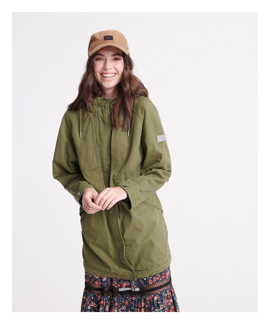 Superdry women's Adventurer Parka coat. This parka coat features, a drawstring hem, a zip and popper fastening, popper adjustable cuff, drawstring waist and hood, two front pockets, a jersey lining to the body and a batwing design to the front. Finished with Superdry branded poppers and zip pulls.