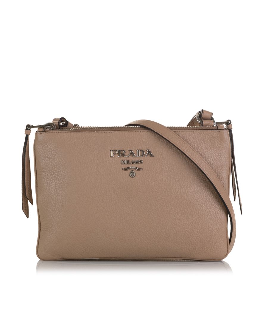 VINTAGE. RRP AS NEW. This crossbody bag features a leather body, an adjustable flat leather shoulder strap, top zip closures, and interior zip and slip pockets.Exterior Front Discolored. Exterior Back Discolored. Exterior Handle Worn. Exterior Corners Scratched, Worn. Embellishment Scratched. Practical Attachment Scratched. \n\nDimensions:\nLength 17cm\nWidth 25cm\nDepth 4cm\nShoulder Drop 57cm\n\nOriginal Accessories: Dust Bag, Dust Bag\n\nSerial Number: 197 B\nColor: Brown x Beige\nMaterial: Leather x Calf\nCountry of Origin: Turkey\nBoutique Reference: SSU197168K1342\n\n\nProduct Rating: VeryGoodCondition\n\nCertificate of Authenticity is available upon request with no extra fee required. Please contact our customer service team.