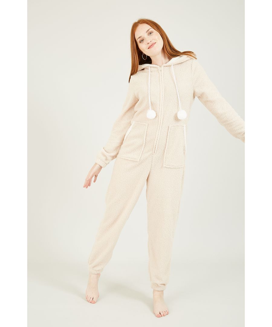 Is it possible to be too cosy? This beige teddy bear onesie certainly comes close. With a zip up front fastening, hanging pom poms, a cute hood and two large pockets. Match with fluffy slippers for the ultimate supersoft fit.