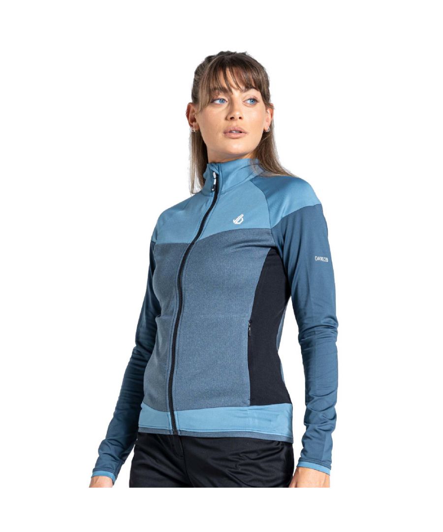 Recycled warm backed stretch fabric with textured grid fabric panels - Ilus Core. Quick drying. Full length zip. High neck for close fit comfort. 2 x lower zip pockets. Stretch binding to cuffs and hem. This product recycled 14 plastic bottles (500ml size).