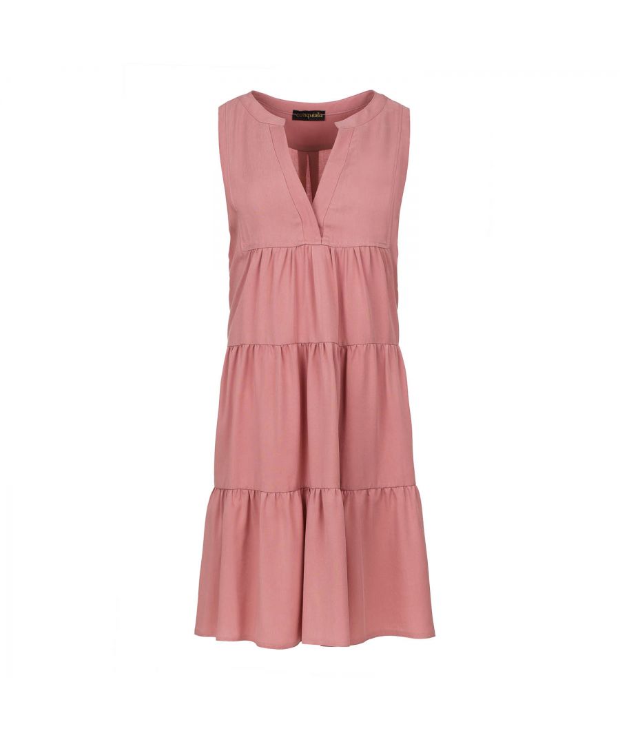 This dusty pink colour dress with gathered seams is crafted in woven viscose fabric. It is sleeveless and has a round neckline with a 24cm V opening in the front. There is a press stud on the inside at the bottom of the V to prevent it opening too much. There is oblong shaped double fabric below the V opening in the front. The dress has two 24cm wide ruched panels. There is a double pleat in the back. The dress is styled in a loose A line silhouette and it hits above the knee.