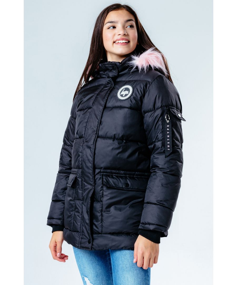 Imagine a jacket that features both the parka style combined with the puffer style, a moment of magic happens. Meet the HYPE. Black Pink Fur Explorer Kids Jacket that's completely versatile. Designed in our standard unisex quilted kids explorer parker shape. With an monochrome embroidered crest on the front. Finished with an MA1 puller on the sleeve pocket and embossed justhype logo zip puller and a faux fur pink hood trim. Machine wash at 30 degrees to keep in new condition.