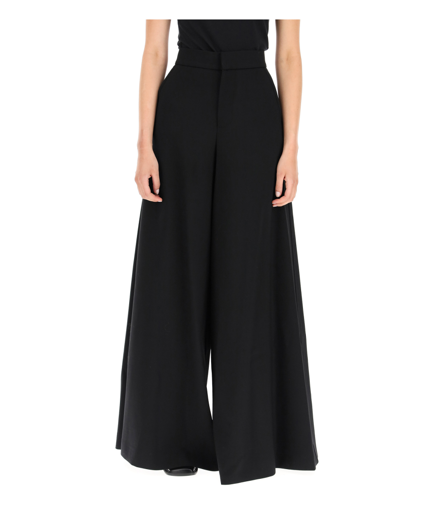 MARNI flare trousers made of stretch wool, characterized by a high waist. Front closure with hook and zip, two side pockets. The model is 177 cm tall and wears size IT 38.