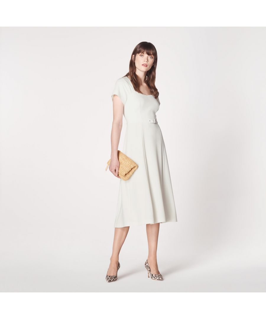 With a beautiful 1940s-inspired neckline, our Emmy dress is full of vintage charm. Crafted from cream crepe, it has a sweetheart neckline with pleat detail, short sleeves, a skinny buckle belt and a flared midi skirt. Play to its vintage look by wearing with a sleek pair of courts and cat eye sunglasses.