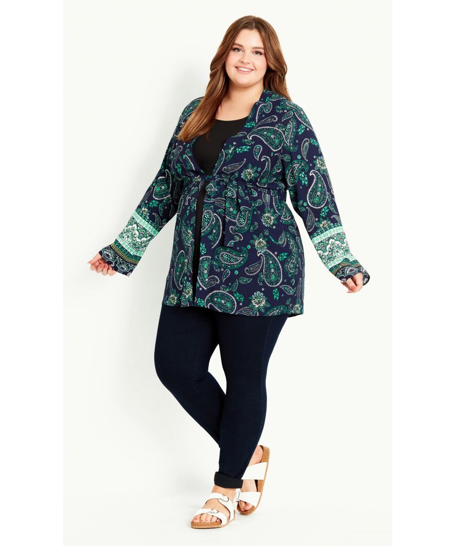 A whimsical layer to your casual outfit! The Paisley Print Kimono features a floaty, lightweight fabrication and eye-catching paisley print, perfect for bringing added style and a pop of print. Elevated by flared sleeves, it's a fun-loving choice for the summer! Key Features Include: - Long flared sleeves - Attached self-tie front - Elasticated back waist - Lightweight non-stretch fabrication - Relaxed fit - Unlined - Hip length Layer over a black tee and jeans, finishing with chunky sandals and a tote.