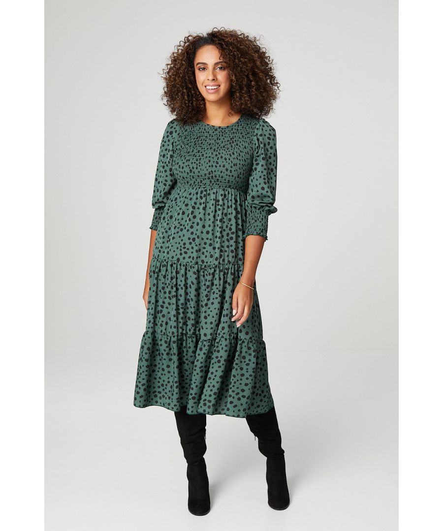 Add a statement everyday dress to your collection with this midi. With a round neck, long sleeves, a shirred bodice and a tiered skirt sitting below the knee. Style with knee high boots and an oversized teddy coat.