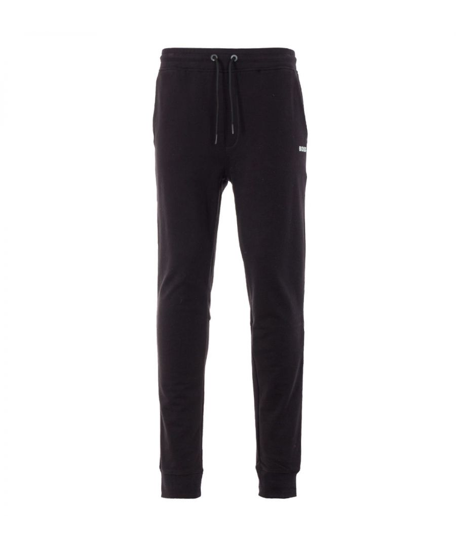 These modern joggers from BOSS have been given a sustainable upgrade for the new season and are crafted from French terry made from soft sustainably sourced African cotton blended with recycled polyester, providing comfortable all day wear. Featuring a drawstring waist, twin slanted side pockets, rear patch pocket and ribbed cuffs. Finished with the iconic BOSS logo rubberised at the left leg.Cotton made in Africa - an initiative of the Aid by Trade Foundation, one of the world\'s leading standards for sustainably produced cotton.Regular Fit, Sustainable Cotton & Recycled Polyester Blend, Adjustable Drawstring Waist, Slanted Side Pockets, Rear Patch Pocket, Elasticated Ribbed Cuffs, Responsible Collection, BOSS Branding. Style & Fit:Regular Fit, Fits True to Size. Composition & Care:83% Cotton, 17% Recycled Polyester, Machine Wash.