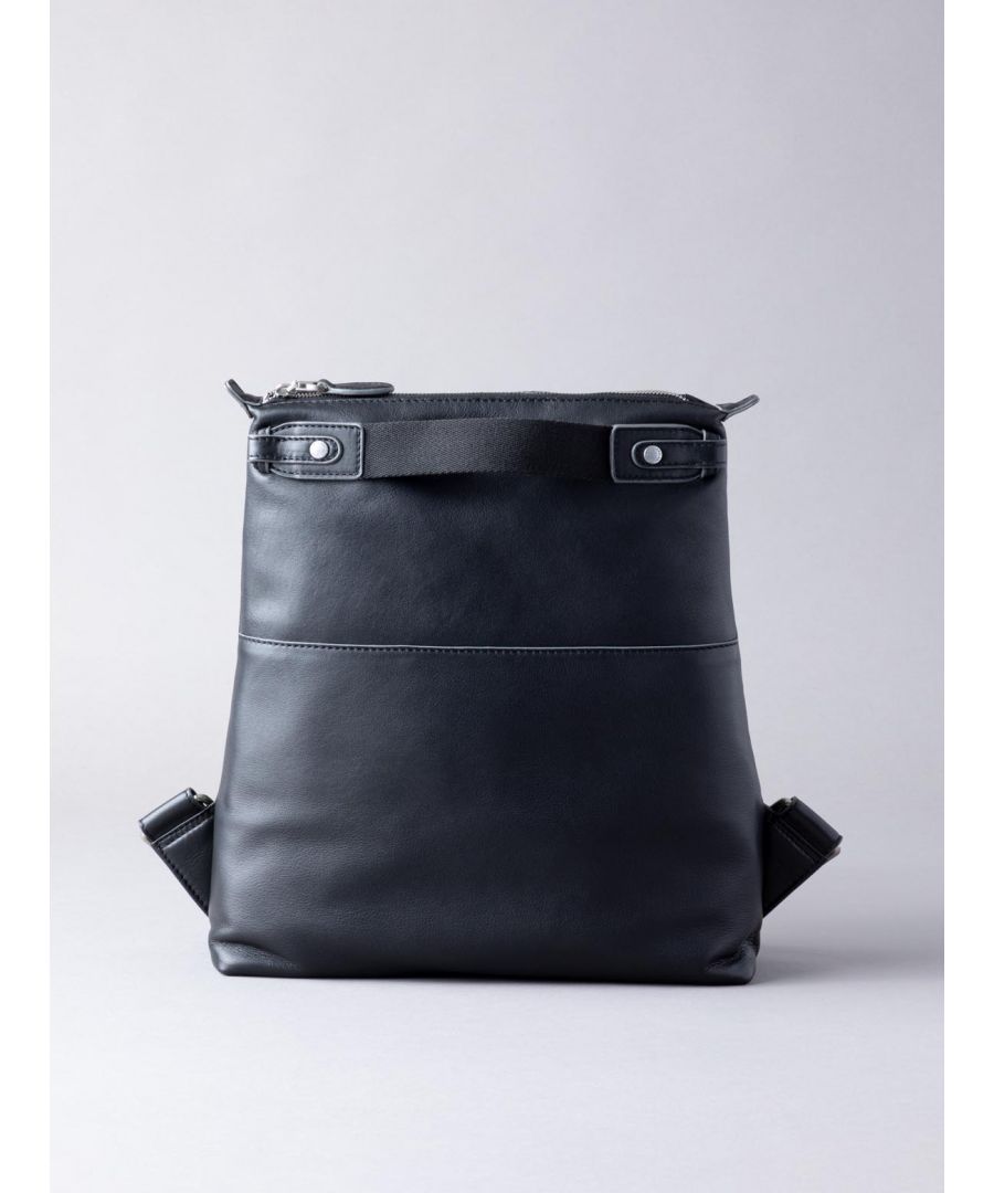 The brand-new Fairfield rucksack, crafted from soft and durable black leather, is the perfect blend of practicality and style. The large interior with zip and slip pockets is secured with zip top fastening, and adjustable cotton back straps and top handles make this a comfy versatile style for your on-the-go needs.Explore our brand-new Fairfield collection which features a range of sizes and colours for you to choose from, no matter what you need.The DetailsStyle: Fairfield Leather RucksackColour: BlackMaterial: Real leatherDimensions: W32 x H34 x D10cmTwo top cotton grab handlesGrab handle drop: 3.5cmAdjustable cotton back straps with leather keepersAdjustable back strap drop: Max 40cm - min 20cmZip fastening at topMatte silver-toned hardwareOn The InsideOne zip pocketTwo slip pocketsFabric lined