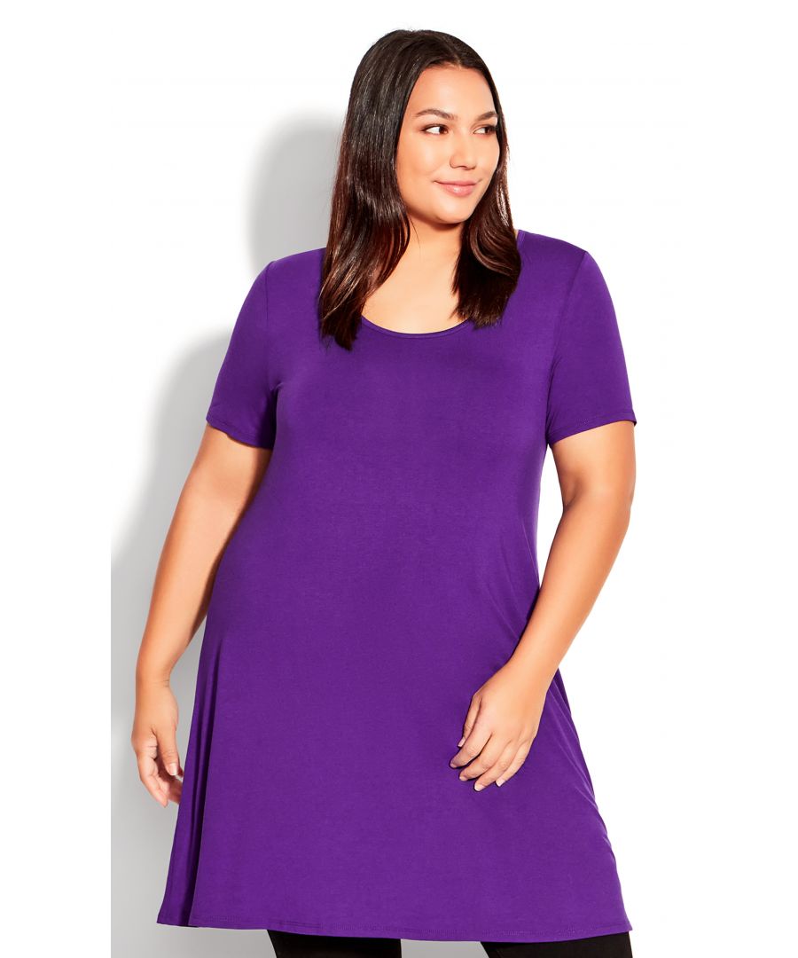 Introducing the vibrant purple Love Swing Tunic! This flattering tunic is perfect for accentuating your curves. The fit and flare silhouette allows for comfort and style no matter what your day throws at you. The soft stretch fabrication and relaxed swing silhouette make this tunic a must-have for your wardrobe. The longline hemline provides coverage and makes this tunic perfect for pairing with leggings or jeans. Add a pop of colour to your wardrobe with the Love Swing Tunic! Key Features Include: - Round neckline - Short sleeves - Pull-over fit - Soft stretch fabrication - Relaxed swing silhouette - Longline hemline