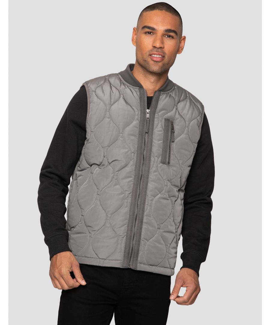When you want to keep on trend and keep cooler weather at bay, this lightweight quilted gilet by Threadbare is perfect. It features shaped quilting on the body and a ribbed neckline, concealed side pockets, an internal phone size pocket and a zip fastening chest pocket. Available in other colours.
