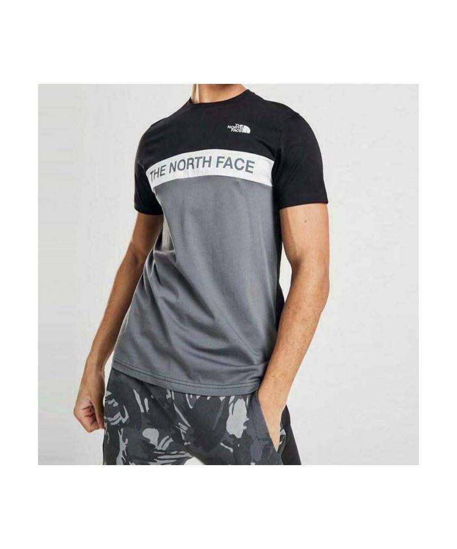 The North Face Men's Woven Colour Block T-shirt.\nCrew Neck, Short Sleeve.\nThis Regular-fit Tee Is Made from Soft Cotton Fabric.\nClassic Cut and Is Finished with Signature The North Face Branding to the Chest.\n100% Cotton.\nMachine Washable.