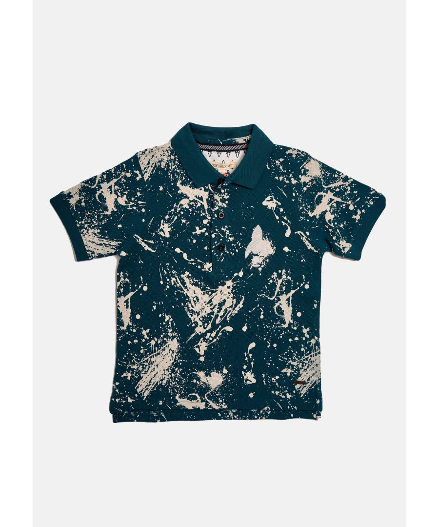 Stand out in the style department with this paint splat print polo. Navy pique with white print  flat rib collar and branded button placket. For a sharp  daytime look  team with skinny jeans and trainers.   Angel & Rocket cares - made with fairtrade cotton   Navy   About me: 100% cotton   Look after me: think planet  Machine wash at 30c