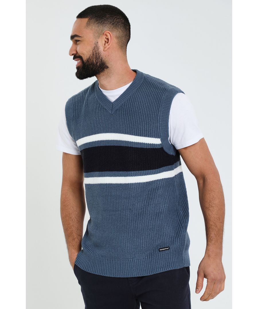 This v neck, knitted sweater vest from Threadbare has a relaxed, sporty feel and can be layered with your favourite jeans and t-shirt or worn on its own. This vest features a contrast colour block stripe design on the chest and ribbed armholes and hem for a classic yet sporty feel. A great addition to your wardrobe this season to smarten up any look.