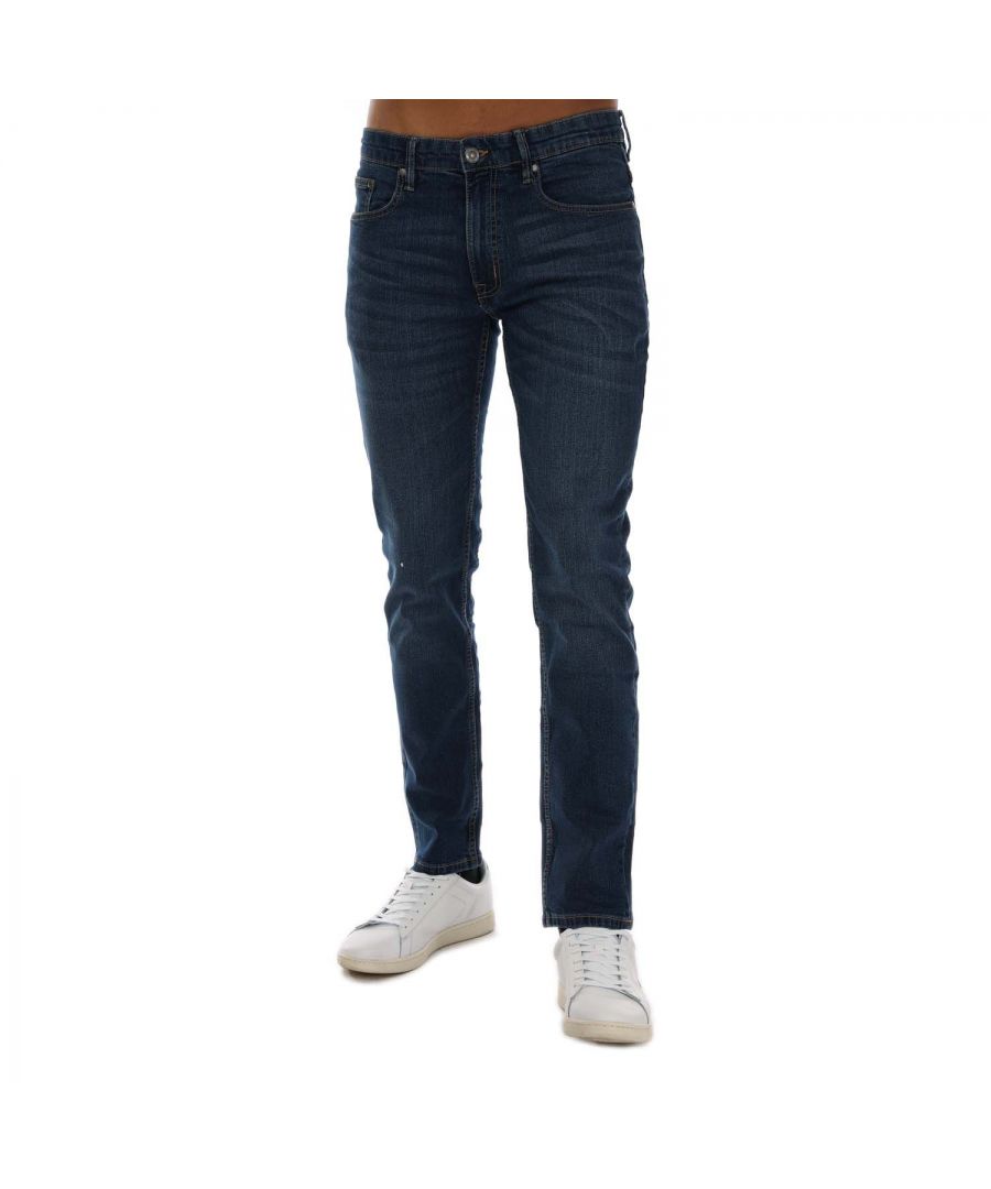 Mens Ben Sherman Mid Wash Slim Fit Jeans in denim.- 5-pocket construction. - Zip fly and button fastening.- Branded leather patch at rear waist.- Slim fit.- 98% Cotton  2% Elastane.- Ref: 0070354