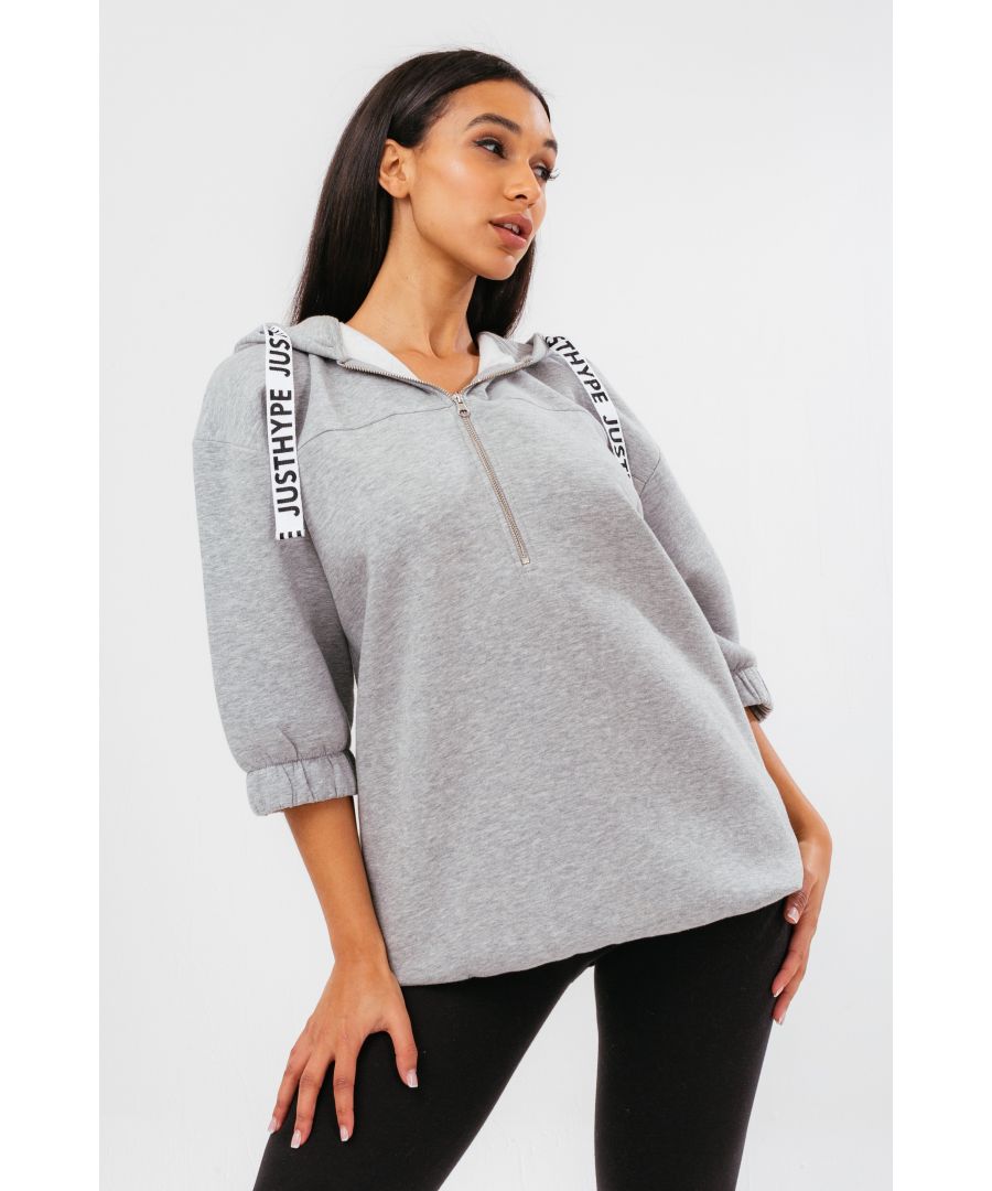 The HYPE. quarter zip grey women's hoodie dress is your new go-to essential outfit. Designed in a grey colourway in our standard women's hood dress shape. With a fixed hood, kangaroo pocket, fitted hem and cuffs in a 80% Cotton 20% Polyester fabric base for the ultimate loungewear comfort. Finished with embossed drawstring pullers. Wear with high-top trainers for an easy on-trend look. Machine wash at 30 degrees.