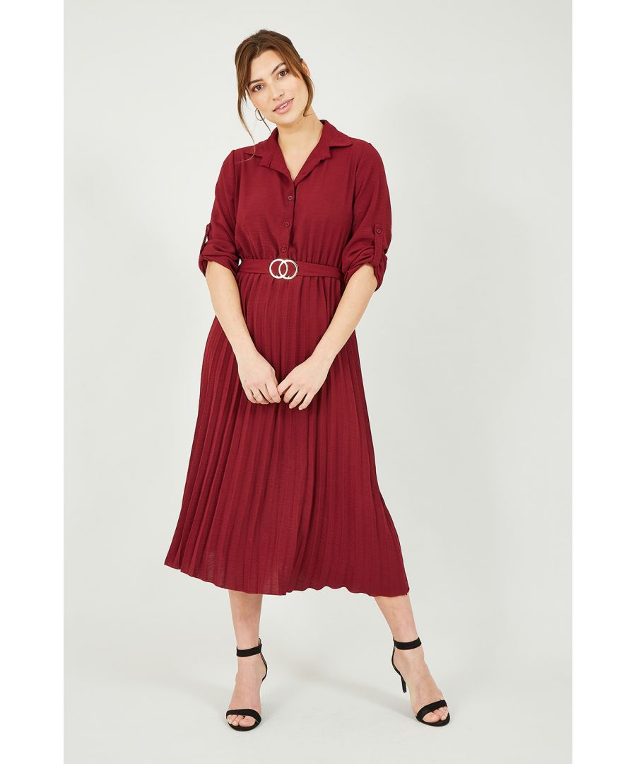 Pleated shirt dress, but make it midi. Lean into that A/W colour palette with this stunning fit by Mela. Features a waist accentuating belt with silver buckle, classic shirt fit with button through fastening and collar, with pleated skirt. In a stunning shade of burgundy, match with suede ankle boots or strappy heels.