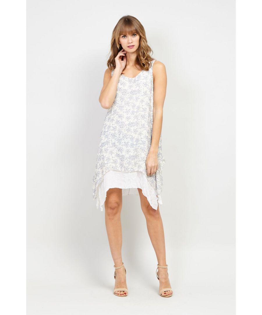 This ditsy floral tunic dress is perfect for the warmer months. It has a contrast layered hem, a round neck and is sleeveless. Wear with wedges and a denim jacket.