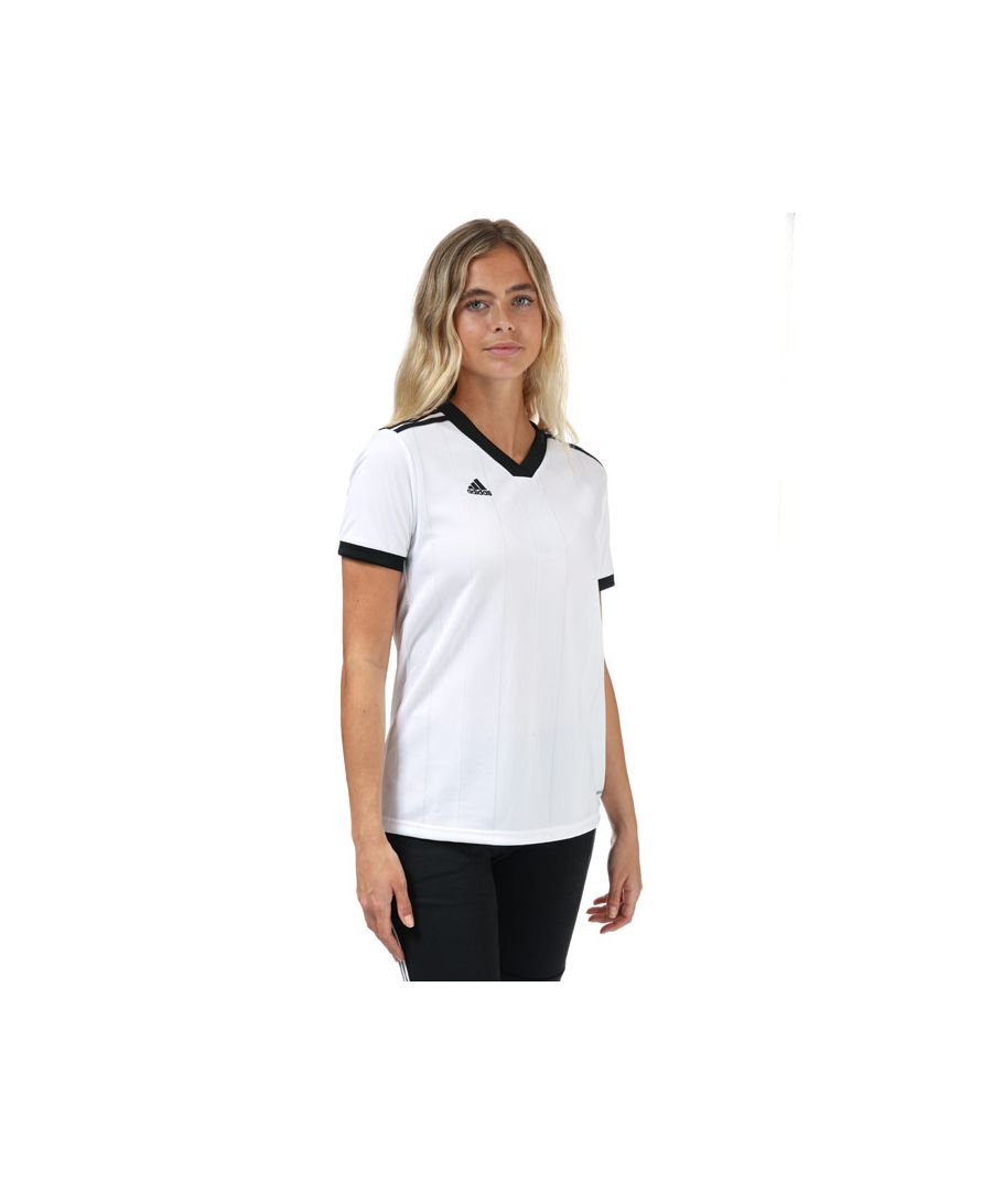Womens adidas Tiro Jersey in white- black.- Ribbed crewneck.- Short sleeves.- Sweat-wicking Climalite fabric.- Subtle striped graphic on the front.- Regular fit is wider at the body  with a straight silhouette.- Main Material: 100% Polyester. Machine washable.- Ref: DY0095