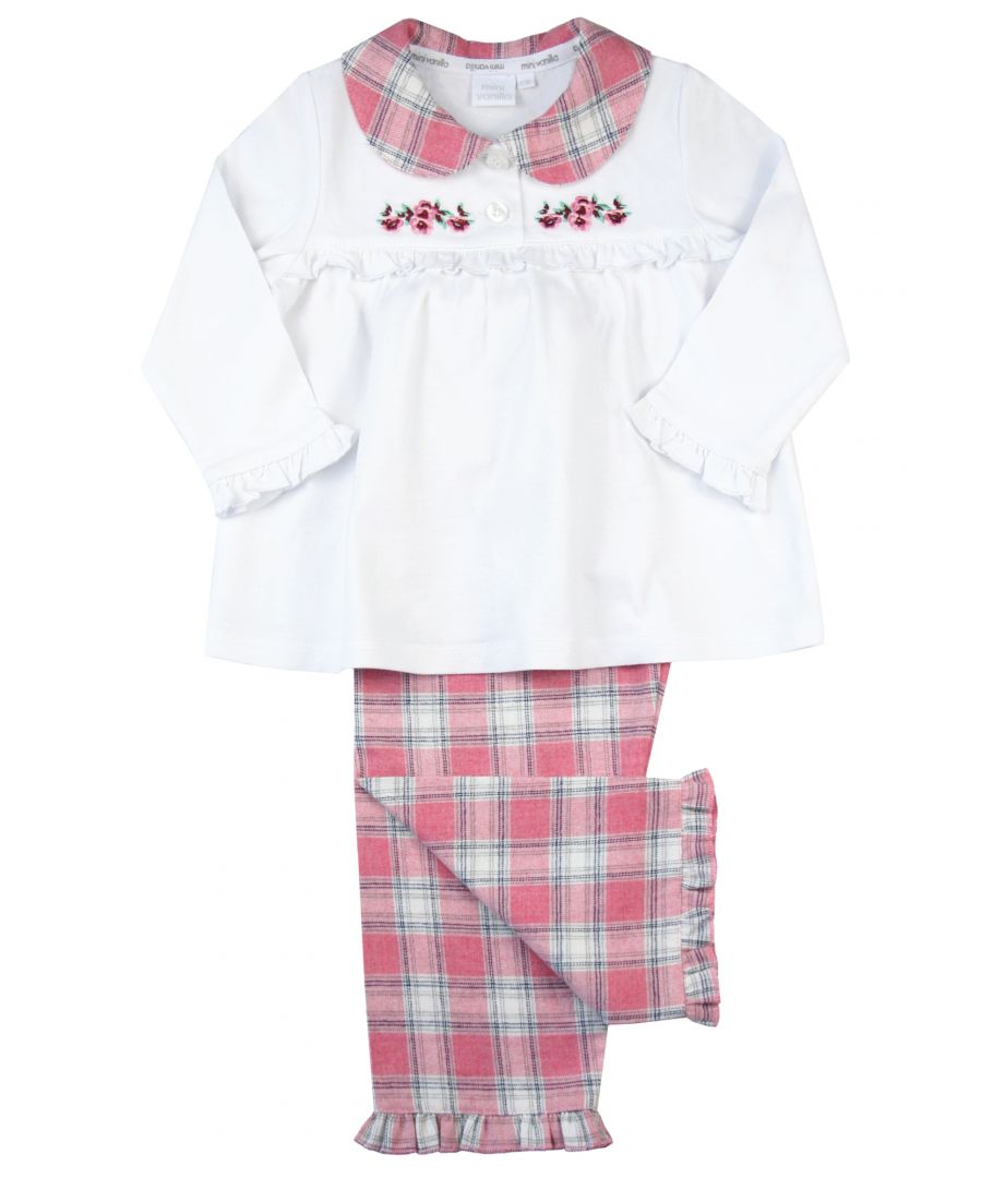Girls Traditional Check / Jersey Cotton Pyjamas.\nOur wonderfully soft pure-cotton woven /jersey pyjamas are a lovely cosy choice for Autumn. This simple-yet-beautiful style includes a jersey top with a check woven cute peter pan collar, a chest floral embroidery that is finished with a pretty frill. Our pretty pink check matching straight-leg trousers have an elasticated waistband for an easy, pull-on style and comfortable fit and a frilled hem. \nFeatures:\n100% cotton\nElasticated waistband\nEngraved buttons\nFloral Embroidery\nMachine wash