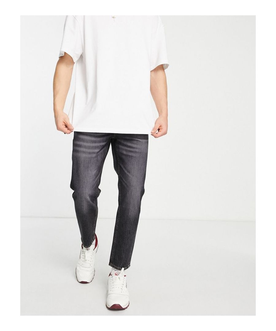 Jeans by ASOS DESIGN It's all in the jeans Regular, tapered fit Belt loops Functional pockets Ripped details  Sold By: Asos