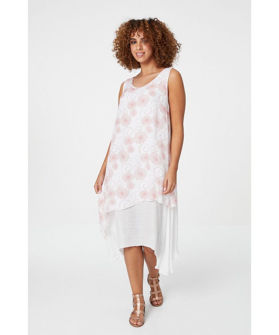 A gorgeous floral printed smock dress which looks great worn in the hotter months. It has a round neck, is sleeveless and has a layered hem, in a midi length. Wear with tan wedges.