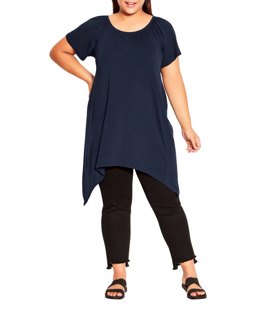 Add a dose of charm to your laidback look wearing the Hanky Hem Plain Tunic. With its optional off shoulder flutter sleeve and handkerchief hemline, this tunic is perfect for upstyling a dreamy brunch outfit. Key Features Include: - Round elasticated neckline - On/off shoulder flutter sleeve - Soft stretch fabrication - Relaxed silhouette - Handkerchief hemline Add a charming finish with an open front knit jumper.