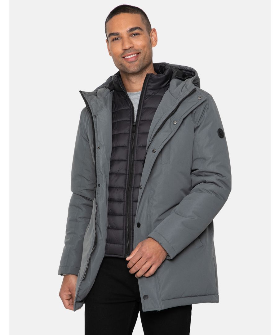 This hooded, padded jacket by Threadbare comes with a zip up mock layer inside for added warmth. There are two deep front pockets, a zip chest pocket and an inner pocket too. The zip is concealed by a popper fastening storm cover.