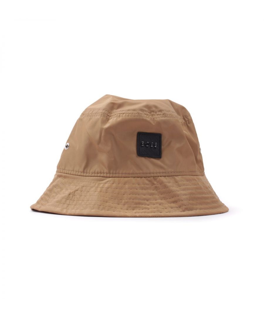 The Saul Essential Recycled bucket hat from BOSS, is a contemporary bucket hat perfect to complete any off-duty look. Crafted from a durable and water resistant recycled polyester, featuring a sloping brim with a soft top and metal eyelet vents. Finished with the iconic BOSS logo patch to the front. Recycled Polyester,  Sloping Brim, Soft Topped, Metal Eyelet Vents, Signature Stripe Internal Trim, BOSS Branding.