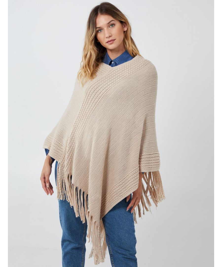Keep warm in this season with our ribbed fringe hem poncho. Soft fabrics and oversized style will going to help you keep this winter warm and cosy. Match with pair of jeans and sneakers for casual look. \n100% Acrylic Machine washable V neckline  Approx.90 cm UnfastenedThis item is a ONE size that fits UK 8-14