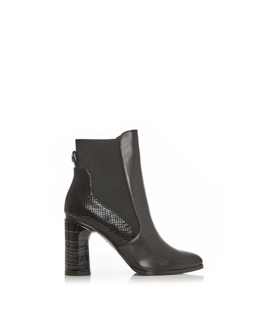 Keep up appearances with Katiee. Complete with a stylish square toe this block heel boot is perfect for day and night. The faux fur lining ensures a comfortable wear whilst the contrasting textures add a new element to the shoe. The elasticised upper allows the boot to move with you whilst also providing a flawless fit. Pair with a dress.