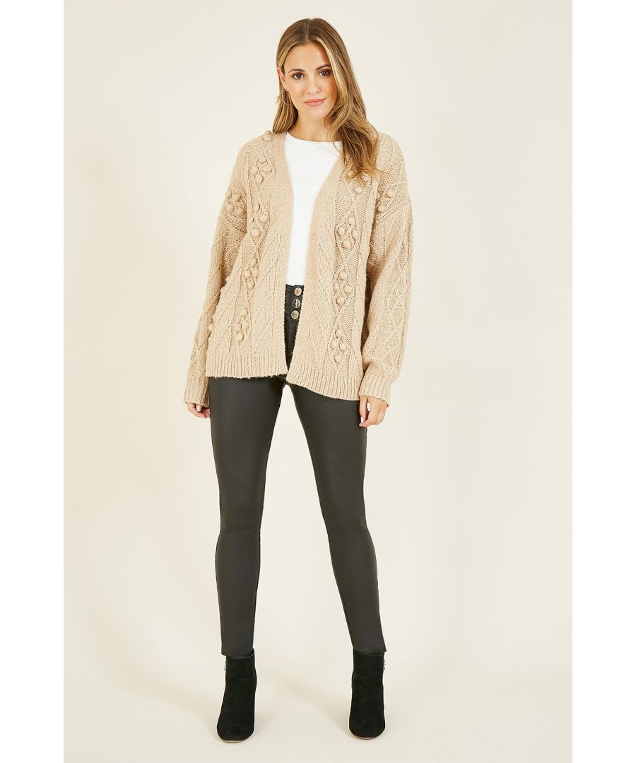 A classic cardigan with a twist, this Yumi Beige Pom Pom Knitted Cardigan will elevate your knitwear game. Look effortlessly cute in this playful cardigan with statement pompoms. With ribbed cuffs and hemline and a super soft, diamond pattern knit, this piece is the perfect neutral autumn essential.