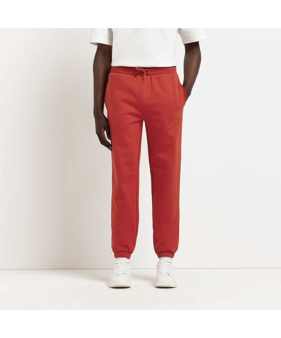 > Brand: River Island> Department: Men> Material: Polyester> Material Composition: 57% Polyester 43% Cotton> Type: Tracksuit> Style: Jogger> Size Type: Regular> Fit: Slim> Closure: Drawstring> Leg Style: Straight> Pattern: No Pattern> Occasion: Casual> Selection: Menswear> Season: SS22