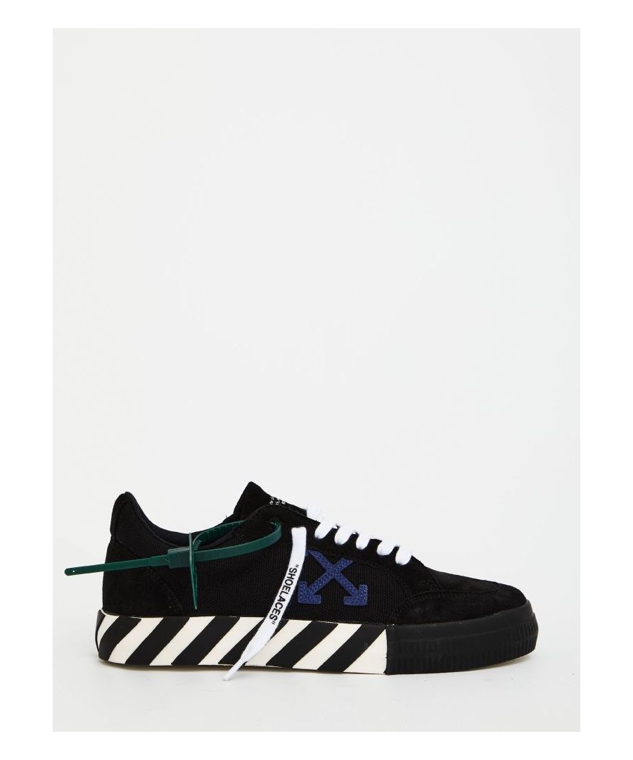 Low Vulcanized sneakers in black and blue cotton. They feature round toe, logoed lace-up closure, side blue arrow patch, Off-White side logo, dark green tag and bicolor rubber sole with a translucent red detail.