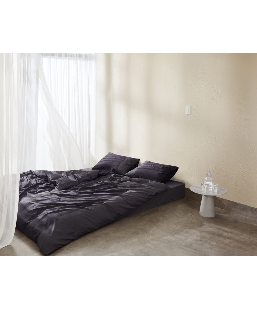 Classic minimalism gets a modern update with the Oversized Paintstroke Duvet Cover from Calvin Klein. The bedding features a blocked and a cut graphic design digitally printed on a 100% cotton, 300TC Sateen ground and reverses to same pattern on the back giving a contemporary update to your bedroom decor with its simple and neat cut. Available in charcoal and  light blue. Pair it with matching pillowcases